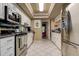 Updated kitchen with stainless steel appliances, granite countertops, and tile backsplash at 140 Dale Pl, Oldsmar, FL 34677