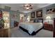Comfortable main bedroom featuring soft carpet, neutral tones, and decorative artwork at 140 Dale Pl, Oldsmar, FL 34677