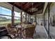 Cozy sunroom with a wood ceiling, lots of windows, ceiling fan and a dining set at 140 Dale Pl, Oldsmar, FL 34677