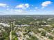 Expansive aerial view of a charming neighborhood with lush greenery, lakes and blue skies at 1743 Fulton Ave, Clearwater, FL 33755