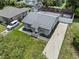 Overhead view showcasing the house, driveway, and surrounding yard in a residential neighborhood at 1743 Fulton Ave, Clearwater, FL 33755