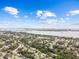 Stunning aerial view of a residential neighborhood near a body of water and city skyline at 1743 Fulton Ave, Clearwater, FL 33755