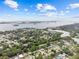Breathtaking aerial view of a neighborhood near a bay, showcasing lush trees and beautiful water views at 1743 Fulton Ave, Clearwater, FL 33755