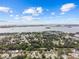 Scenic aerial shot of a residential community with a waterfront and city skyline backdrop at 1743 Fulton Ave, Clearwater, FL 33755
