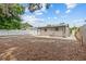 Spacious backyard with a white fence, offering privacy and room for outdoor activities at 1743 Fulton Ave, Clearwater, FL 33755