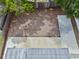 Aerial view of the backyard space, featuring a concrete patio and wood mulch at 1743 Fulton Ave, Clearwater, FL 33755