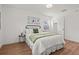 Cozy bedroom featuring hardwood floors and stylish decor at 1743 Fulton Ave, Clearwater, FL 33755