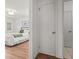 View of bedroom with hardwood flooring, white paint and trim, and a ceiling fan at 1743 Fulton Ave, Clearwater, FL 33755