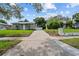 Wide driveway leading to the home, nestled in a well-kept neighborhood at 1743 Fulton Ave, Clearwater, FL 33755