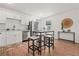 Bright eat-in kitchen with stainless appliances and modern finishes at 1743 Fulton Ave, Clearwater, FL 33755