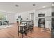 Bright eat-in kitchen featuring white cabinets and stainless steel appliances with an island and bar stool seating at 1743 Fulton Ave, Clearwater, FL 33755
