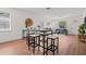 Open concept living and dining area with lots of natural light and wood flooring at 1743 Fulton Ave, Clearwater, FL 33755