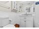 Bathroom featuring beadboard and a white vanity with marble countertop at 1813 Bough Ave # B, Clearwater, FL 33760