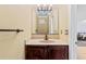 Bathroom with vanity and stone countertop and a decorative mirror at 1813 Bough Ave # B, Clearwater, FL 33760
