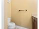Bathroom with toilet and towel rack and a vanity cabinet at 1813 Bough Ave # B, Clearwater, FL 33760