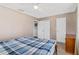 Bedroom featuring two closets, carpet and neutral walls at 1813 Bough Ave # B, Clearwater, FL 33760