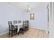 Cozy dining room showcasing a classic chandelier and a table set for six guests at 1813 Bough Ave # B, Clearwater, FL 33760