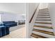 Living room adjacent to stairs to the second floor in a well lit area at 1813 Bough Ave # B, Clearwater, FL 33760