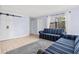 Comfortable living room featuring tile floor, neutral walls, comfortable seating and natural light at 1813 Bough Ave # B, Clearwater, FL 33760