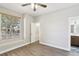 Comfortable bedroom with large windows, walk-in closet, and ensuite bathroom at 19113 Golden Cacoon Pl, Lutz, FL 33558