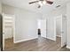 Bright bedroom with ceiling fan, walk-in closet, and ensuite bathroom at 19113 Golden Cacoon Pl, Lutz, FL 33558