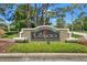 Landora community sign featuring stone accents, well manicured plants and lush landscaping at 19113 Golden Cacoon Pl, Lutz, FL 33558
