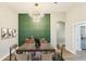 Formal dining area with a statement light fixture and decorative accent wall at 19113 Golden Cacoon Pl, Lutz, FL 33558