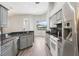 Modern kitchen with stainless steel appliances and granite countertops at 19113 Golden Cacoon Pl, Lutz, FL 33558
