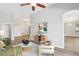Bright living room showcasing stylish decor, neutral walls, and seamless flow into other living spaces at 19113 Golden Cacoon Pl, Lutz, FL 33558