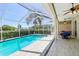 Inviting pool and patio under a screened enclosure, providing a perfect outdoor living space at 19113 Golden Cacoon Pl, Lutz, FL 33558