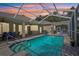 Enjoy outdoor living with this screened-in pool area perfect for entertaining and relaxation at 19113 Golden Cacoon Pl, Lutz, FL 33558