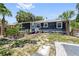 Backyard featuring a brick patio, landscaped garden, and home exterior at 2026 Union S St, St Petersburg, FL 33712