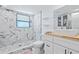 Modern bathroom featuring a marble tiled walk-in shower, floating shelves, and wood countertop at 2026 Union S St, St Petersburg, FL 33712