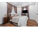 Comfortable bedroom with hardwood floors, neutral bedding, and ample natural light at 2026 Union S St, St Petersburg, FL 33712