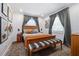 Inviting bedroom with a wooden bed frame, area rug, and plenty of natural light at 2026 Union S St, St Petersburg, FL 33712