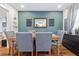Traditional dining room featuring a wood table with upholstered chairs and decorative teal accent wall at 2026 Union S St, St Petersburg, FL 33712