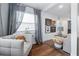 Cozy seating area with wood floors, natural light, and neutral decor enhancing a comfortable and inviting atmosphere at 2026 Union S St, St Petersburg, FL 33712
