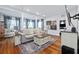 Cozy living room featuring hardwood floors, neutral colored sofa and decorative area rug at 2026 Union S St, St Petersburg, FL 33712