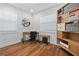 Bright office features modern wood floors, sleek desk, and white built-in storage shelves at 2026 Union S St, St Petersburg, FL 33712
