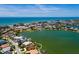 Breathtaking aerial view highlighting the property's beautiful waterfront location near the coast and city at 208 Bath Club N Blvd, North Redington Beach, FL 33708