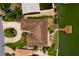 Aerial shot of the property showcasing the roof, dock, and landscaping at 208 Bath Club N Blvd, North Redington Beach, FL 33708