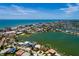 Wide aerial view capturing waterfront residences with dock access, surrounded by serene waterways at 208 Bath Club N Blvd, North Redington Beach, FL 33708
