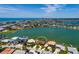 Aerial view of the property showcasing its waterfront location, private dock, and proximity to the beach at 208 Bath Club N Blvd, North Redington Beach, FL 33708