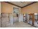 Interior view showing access to the garage, displaying the home's layout and repair status at 208 Bath Club N Blvd, North Redington Beach, FL 33708