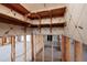 Interior shot of room with shelving and wallpaper, undergoing renovations with exposed framing at 208 Bath Club N Blvd, North Redington Beach, FL 33708