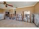 Open-concept living room leading to the partially renovated bathroom and other rooms in need of repair at 208 Bath Club N Blvd, North Redington Beach, FL 33708