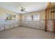 Well-lit living room features multiple windows with tropical outdoor views, ready to be updated at 208 Bath Club N Blvd, North Redington Beach, FL 33708