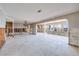 Unfinished space offering abundant natural light, with exposed framing and waterfront views in the distance at 208 Bath Club N Blvd, North Redington Beach, FL 33708