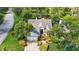 Aerial view of the home's front yard, landscaping, driveway and lawn at 2182 Trevor Rd, Palm Harbor, FL 34683