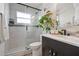Modern bathroom featuring a glass-enclosed shower, floating shelf, and sleek fixtures, creating a spa-like atmosphere at 2182 Trevor Rd, Palm Harbor, FL 34683